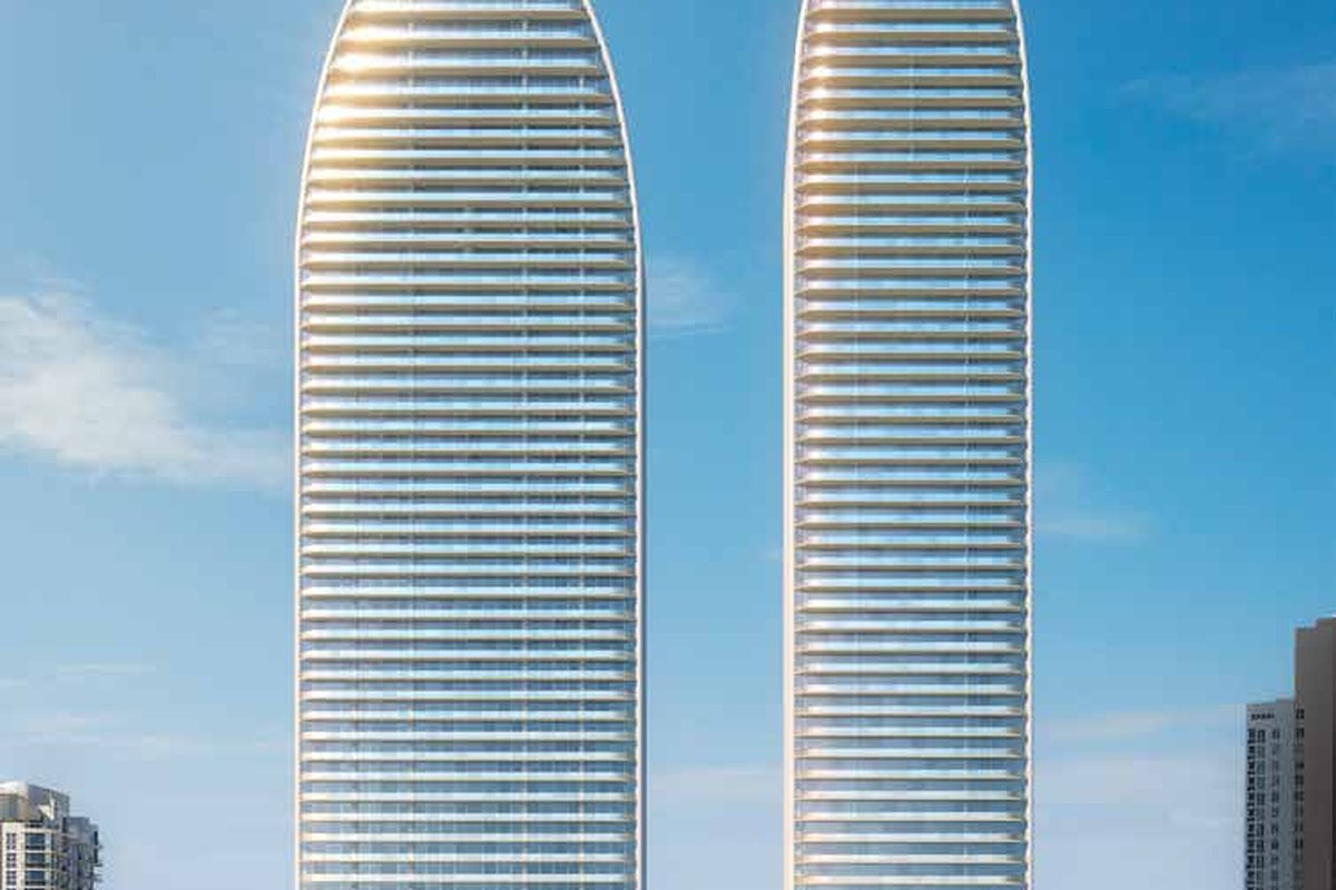 Rendering of the two St Regis Residences towers rising directly above the beach at Sunny Isles