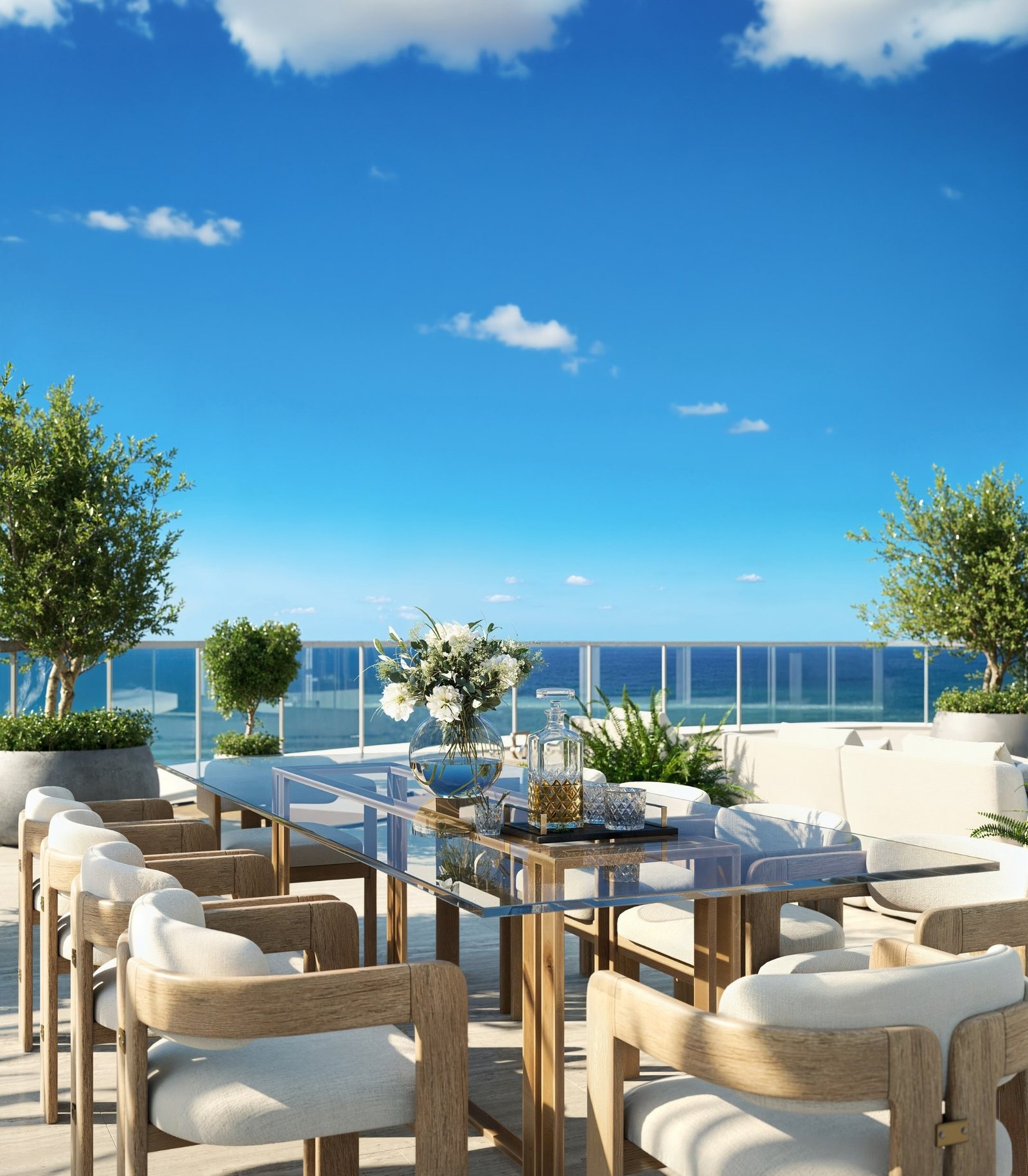Render de la terraza de comedor exterior del Upper Penthouse con el océano tras la baranda de vidrio