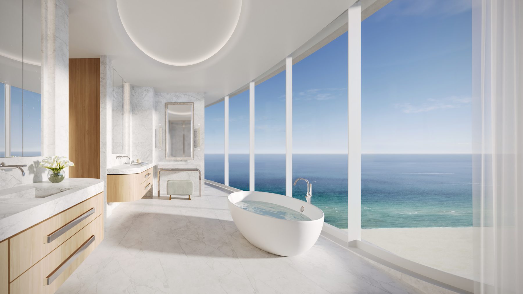Render de un baño principal con tina exenta frente al mar